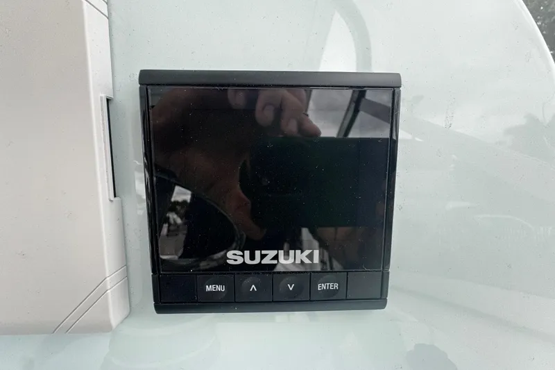 Slide: The Image of Suzuki control panel on 2026 Sea Pro 240 Dual Console boat. - 14