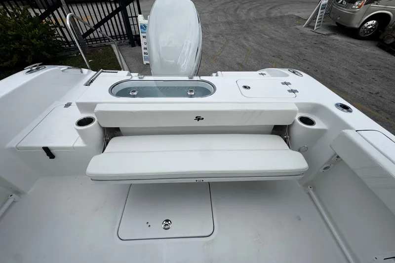Slide: The Image of 2026 Sea Pro 240 Dual Console boat interior with seating and storage features. - 19