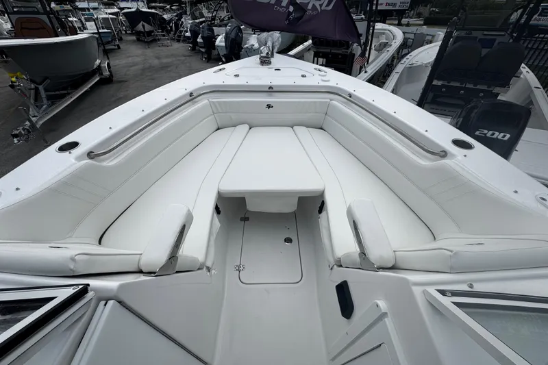 Slide: The Image of 2026 Sea Pro 240 Dual Console boat with spacious white seating area. - 4