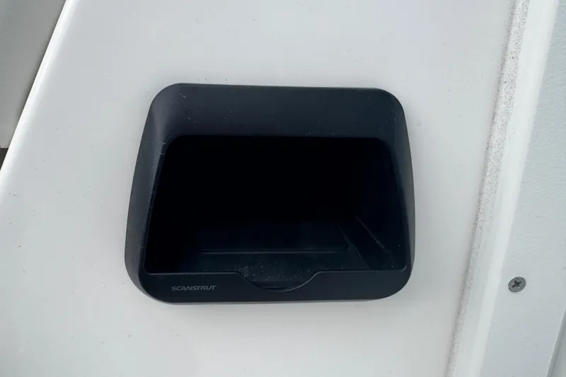 Slide: The Image of Black storage compartment on 2026 Sea Pro 240 Dual Console boat. - 9