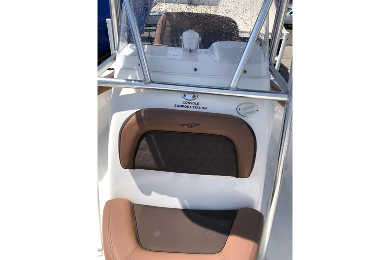 Slide: The Image of 2018 Tidewater 210 CC Adventure boat console with comfort seating and protective railing. - 3