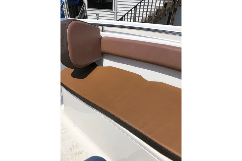 Slide: The Image of Brown cushioned seating on a 2018 Tidewater 210 CC Adventure boat. - 5
