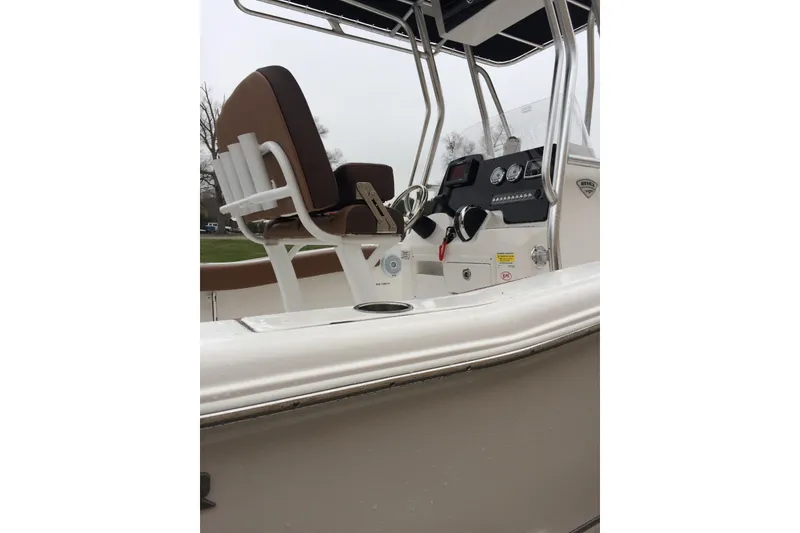 Slide: The Image of 2018 Tidewater 210 CC Adventure boat interior with steering console and seating. - 8