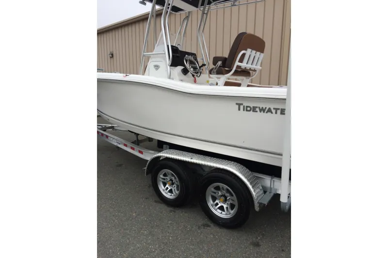 Slide: The Image of 2018 Tidewater 210 CC Adventure boat on trailer, side view. - 9