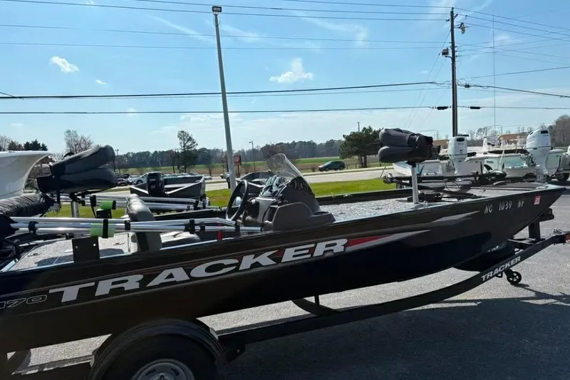 Slide: The Image of 2025 Tracker Pro 170 boat on trailer in outdoor setting. - 2