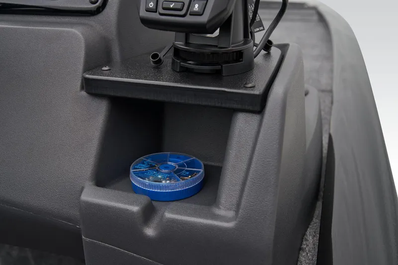 Slide: The Image of Manufacturer Provided Image: 2025 Tracker Pro 170 boat console with storage compartment and electronic device. - 42