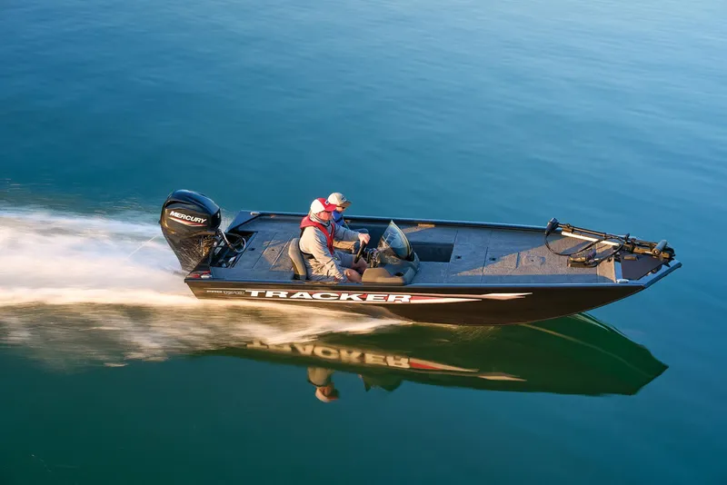Slide: The Image of Manufacturer Provided Image: 2025 Tracker Pro 170 boat speeding on calm water, showcasing sleek design and performance. - 59