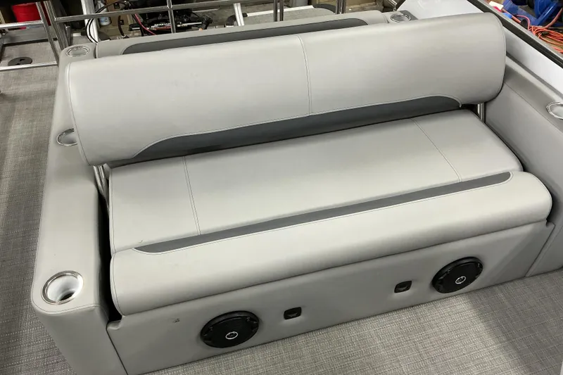 Slide: The Image of 2025 Bentley Pontoons Legacy 240 Swingback seating with integrated speakers and cup holders. - 12