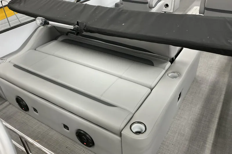 Slide: The Image of 2025 Bentley Pontoons Legacy 240 Swingback interior seating with cup holders and speaker system. - 13