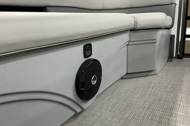 Slide: The Image of 2025 Bentley Pontoons Legacy 240 Swingback interior seating with speaker detail. - 15