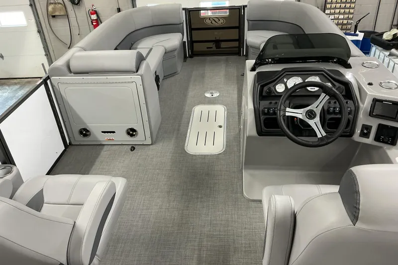 Slide: The Image of 2025 Bentley Pontoons Legacy 240 Swingback interior with modern helm and seating. - 7