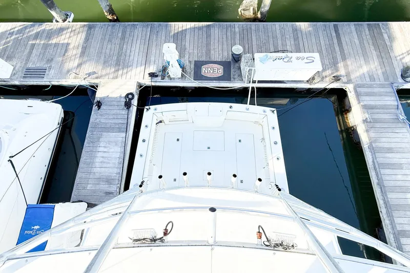 Slide: The Image of Overhead view of a 1996 Cabo 35 Express docked at a marina. - 11