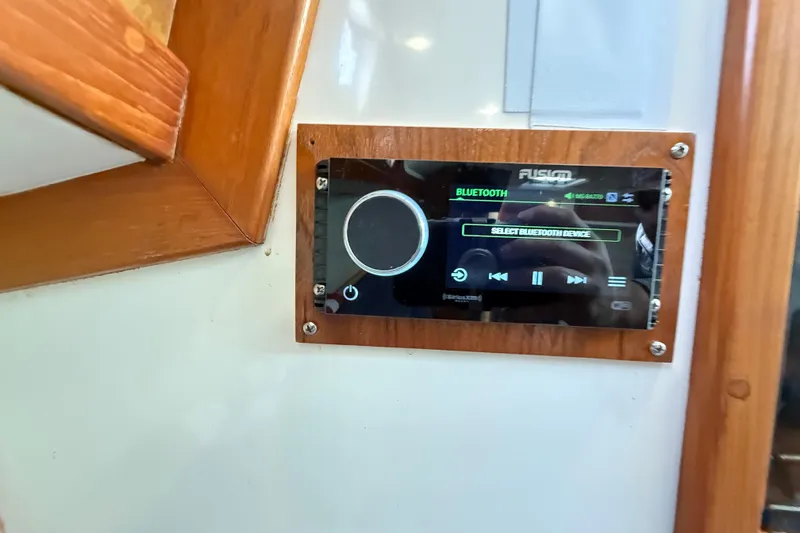 Slide: The Image of Fusion Bluetooth stereo system on 1996 Cabo 35 Express boat interior. - 31