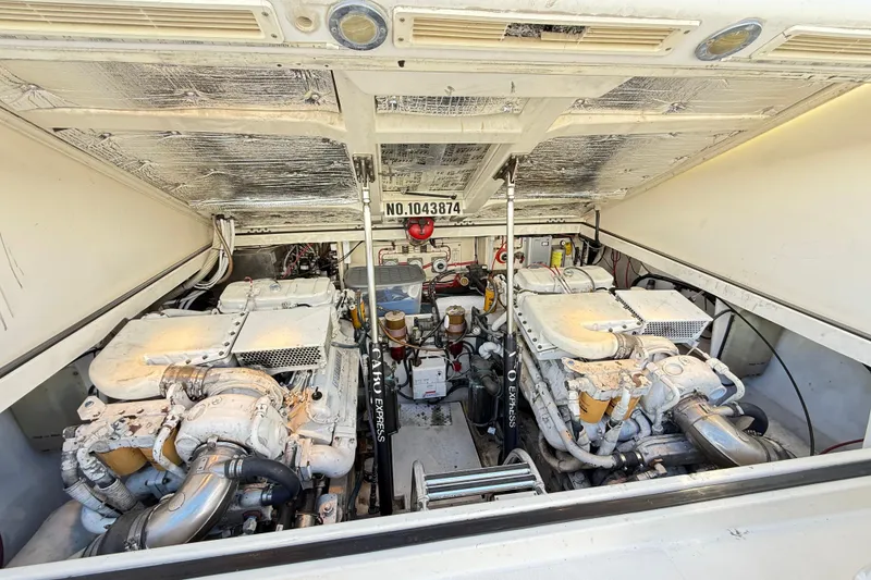 Slide: The Image of Engine room of a 1996 Cabo 35 Express boat, showcasing dual engines. - 37