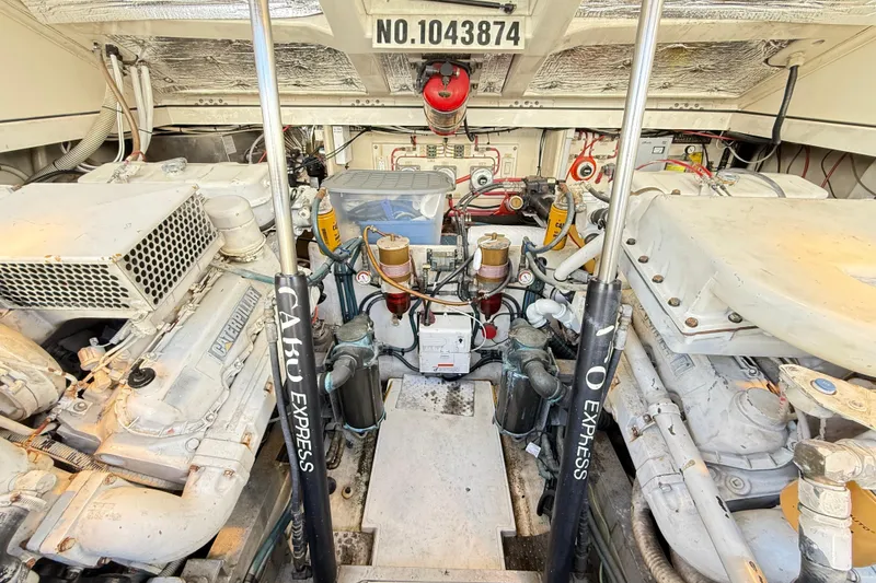 Slide: The Image of Engine room of a 1996 Cabo 35 Express boat, showcasing machinery and components. - 38