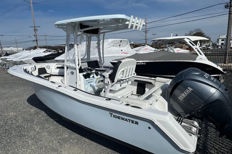 Slide: The Image of 2025 Tidewater 220 LXF boat with Yamaha engine, displayed outdoors. - 3