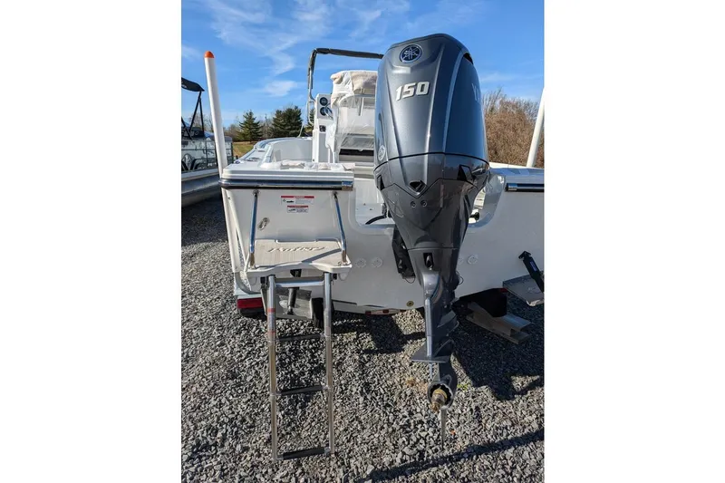 Slide: The Image of 2025 Parker 18SE Center Console boat with Yamaha 150 outboard motor and boarding ladder. - 8