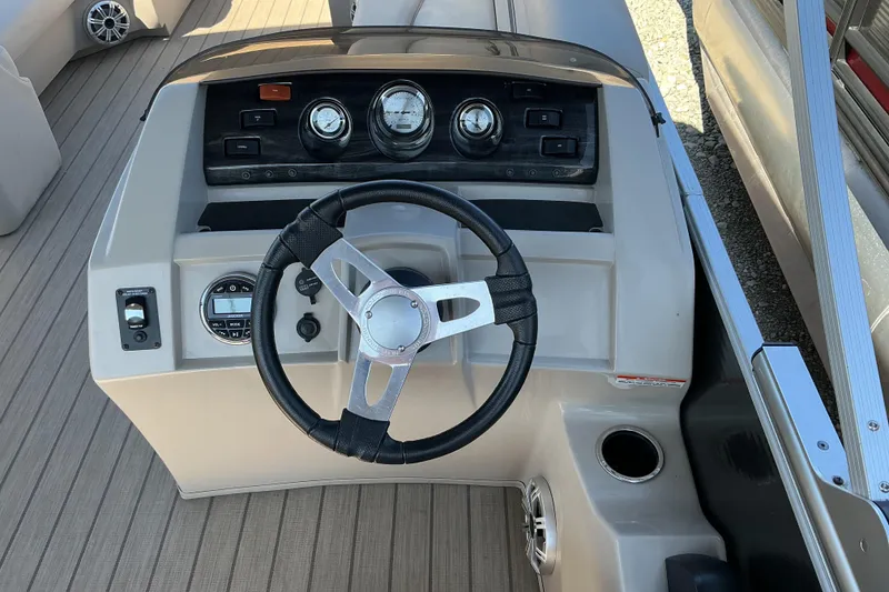 Slide: The Image of 2018 Bennington SX 21 SLXP boat dashboard with steering wheel and gauges. - 7
