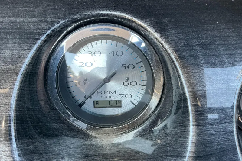 Slide: The Image of Close-up of 2018 Bennington SX 21 SLXP RPM gauge displaying 1338 hours. - 8
