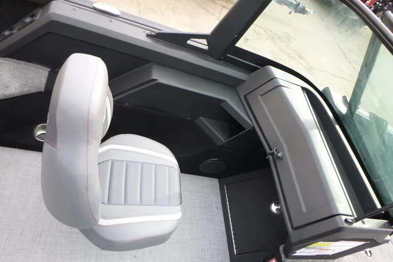 Slide: The Image of 2025 Alumacraft Competitor 175X Sport interior with gray seating and dashboard. - 12