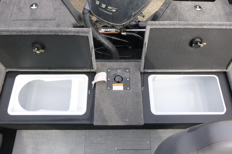 Slide: The Image of 2025 Alumacraft Competitor 175X Sport boat storage compartments with Yamaha engine. - 14