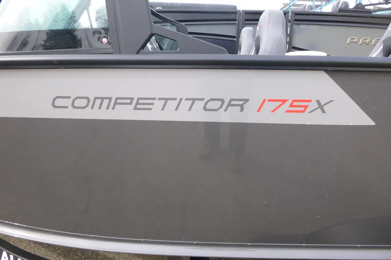 Slide: The Image of 2025 Alumacraft Competitor 175X Sport boat side view with model branding. - 16