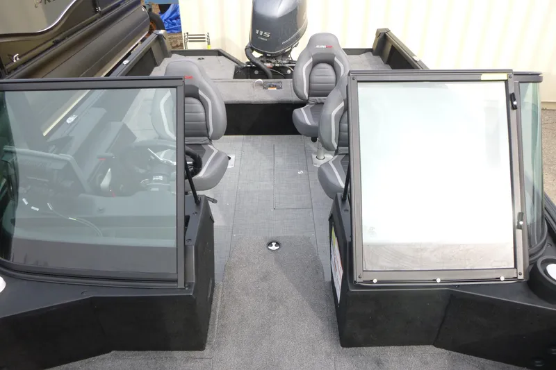 Slide: The Image of 2025 Alumacraft Competitor 175X Sport boat interior with seating and windshield. - 4
