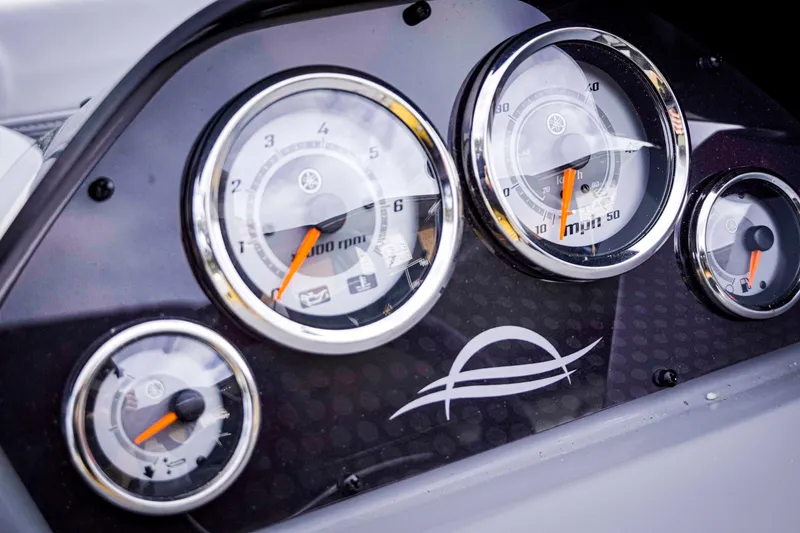 Slide: The Image of Dashboard of 2025 SunCatcher Fusion 322RC with speedometer and tachometer gauges. - 16