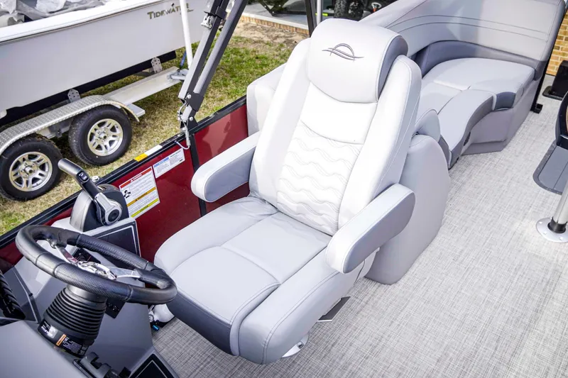 Slide: The Image of Captain's chair in 2025 SunCatcher Fusion 322RC boat, featuring sleek design and comfortable seating. - 17