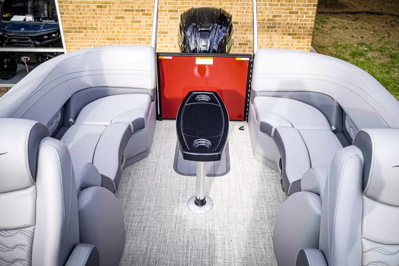 Slide: The Image of 2025 SunCatcher Fusion 322RC boat interior with plush seating and sleek table design. - 19