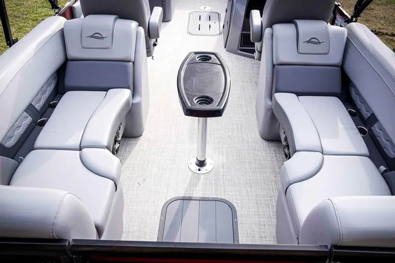Slide: The Image of Luxurious seating area on 2025 SunCatcher Fusion 322RC pontoon boat with central table. - 20