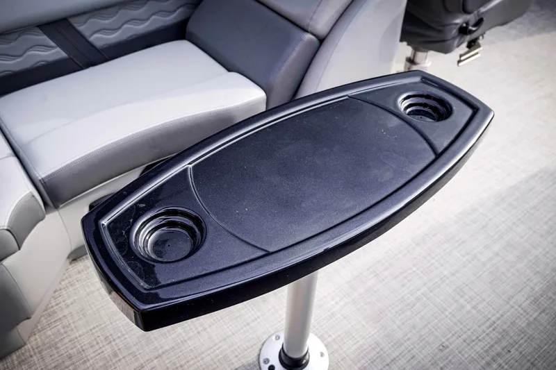 Slide: The Image of Cup holder table on 2025 SunCatcher Fusion 322RC boat interior. - 21