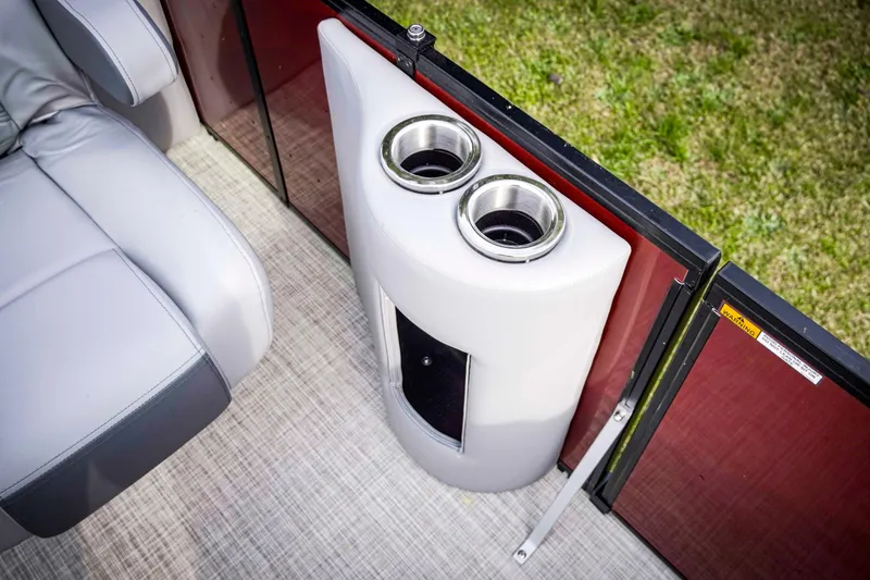 Slide: The Image of Luxurious seating and cup holders on 2025 SunCatcher Fusion 322RC boat. - 22