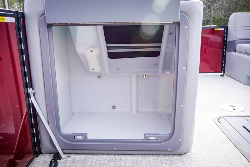 Slide: The Image of Open storage compartment on 2025 SunCatcher Fusion 322RC boat, featuring spacious interior. - 27