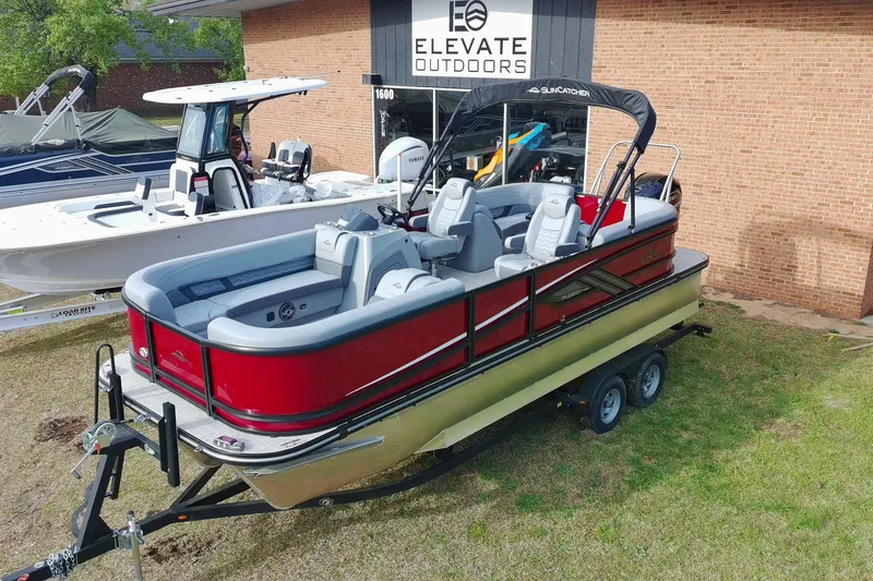 Slide: The Image of 2025 SunCatcher Fusion 322RC pontoon boat displayed at Elevate Outdoors dealership. - 31