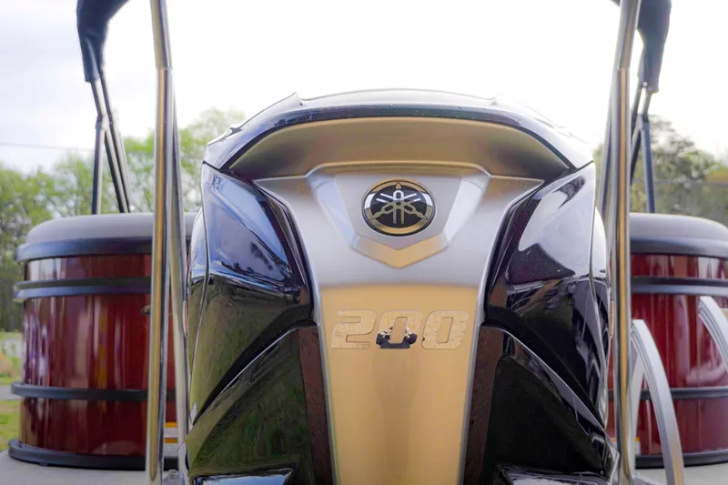 Slide: The Image of 2025 SunCatcher Fusion 322RC boat engine, featuring a sleek design and 200 horsepower. - 7