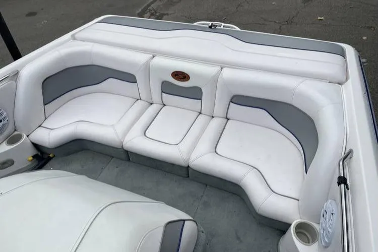 Slide: The Image of 2001 Supra Legacy boat interior with white and gray seating arrangement. - 2