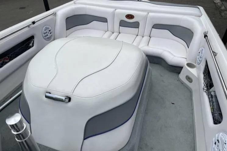 Slide: The Image of 2001 Supra Legacy boat interior with white and gray seating, featuring modern design elements. - 6