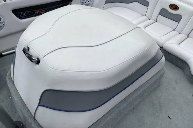 Slide: The Image of 2001 Supra Legacy boat interior with white and gray cushioned seating. - 7