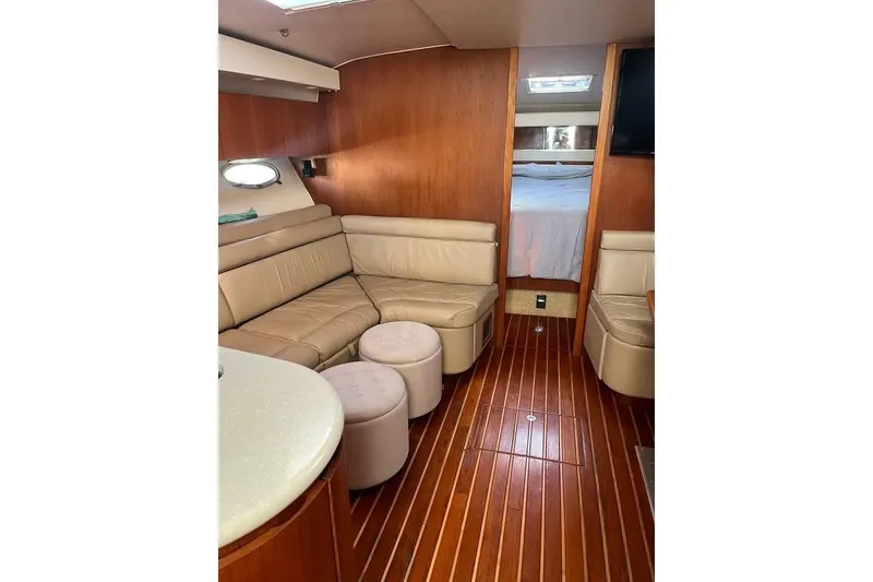 Slide: The Image of Luxurious interior of 2002 Tiara Yachts 4300 Open with leather seating and wood flooring. - 12