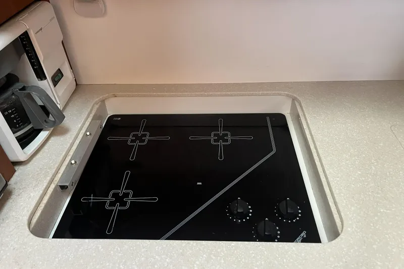 Slide: The Image of Built-in stovetop in 2002 Tiara Yachts 4300 Open galley kitchen. - 18