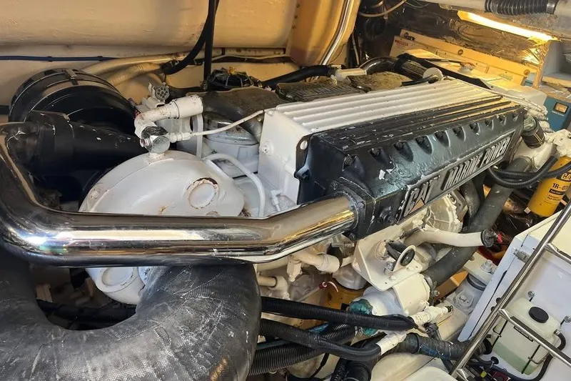 Slide: The Image of Engine room of a 2002 Tiara Yachts 4300 Open, featuring a CAT Marine Power engine. - 23