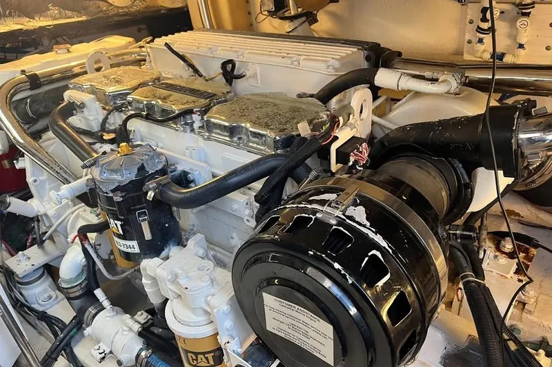 Slide: The Image of Engine room of a 2002 Tiara Yachts 4300 Open, showcasing detailed machinery components. - 24