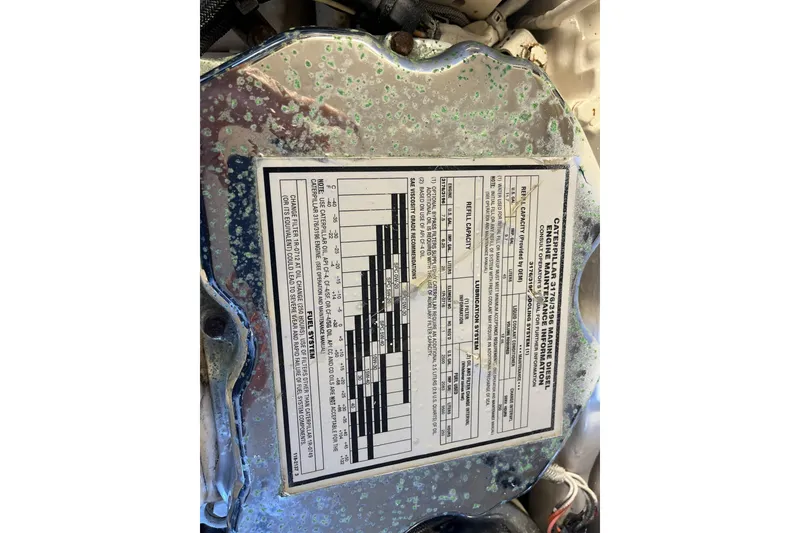 Slide: The Image of Engine label on a 2002 Tiara Yachts 4300 Open, displaying specifications and maintenance details. - 29