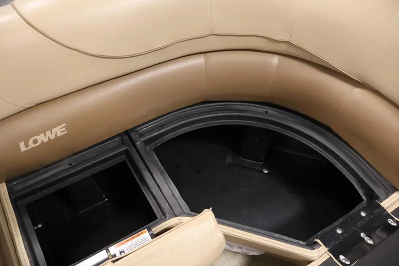 Slide: The Image of 2021 Lowe SS 230 WT boat interior storage compartment with beige seating. - 14
