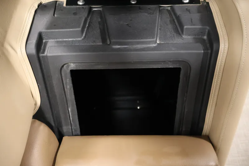 Slide: The Image of Storage compartment in 2021 Lowe SS 230 WT boat with beige seating. - 16