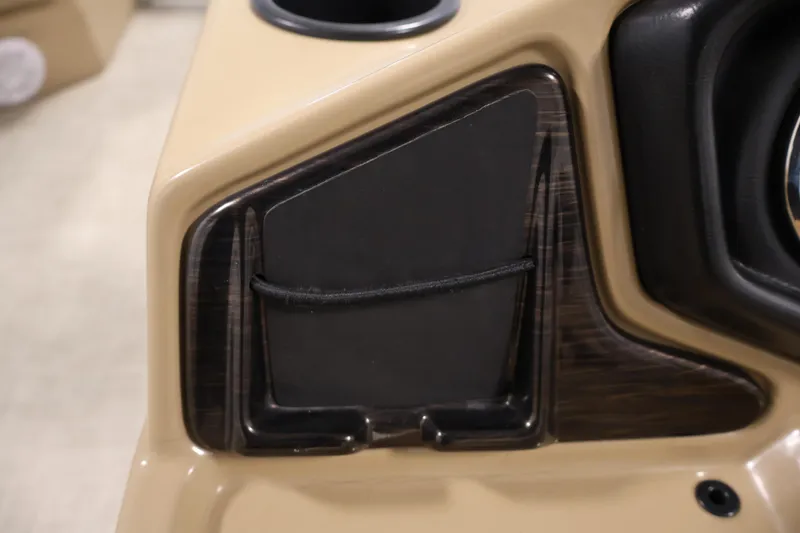 Slide: The Image of Dashboard detail of 2021 Lowe SS 230 WT boat with storage compartment. - 23