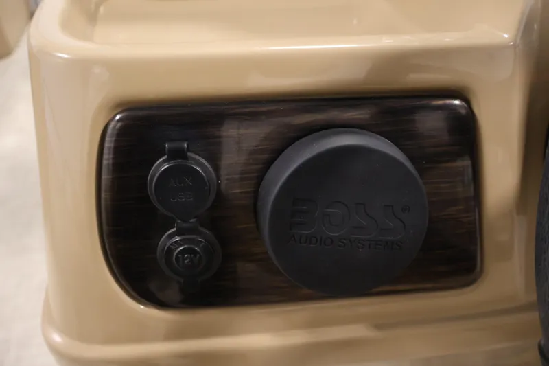 Slide: The Image of Audio system panel with AUX, USB, and 12V ports on a 2021 Lowe SS 230 WT. - 25