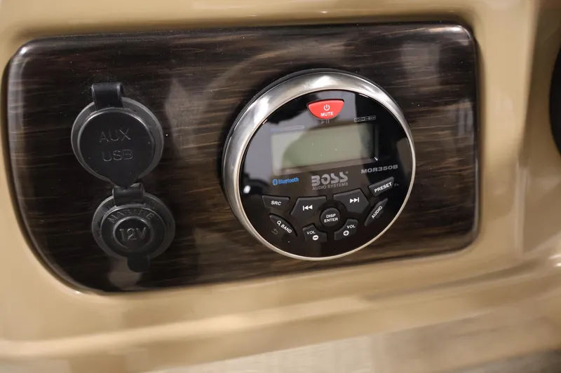 Slide: The Image of Audio system panel with AUX, USB, and 12V inputs on a 2021 Lowe SS 230 WT. - 26