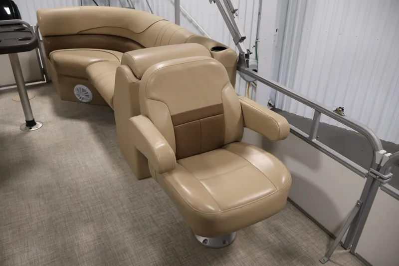Slide: The Image of Luxurious seating on 2021 Lowe SS 230 WT pontoon boat, featuring beige upholstery. - 29